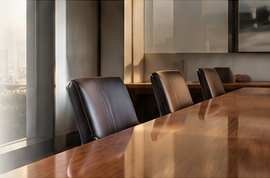 A polished boardroom table overlooking Sydney